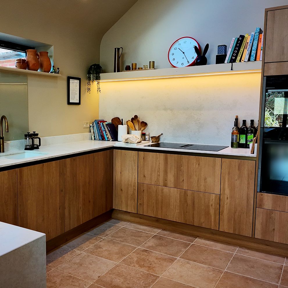 Kitchen with white worktops and built-in ovens