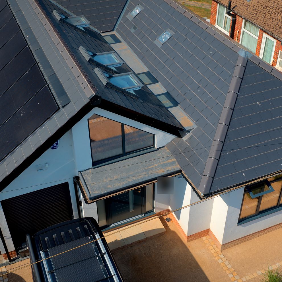 Aerial view of a completed roof, rooflights and front elevation
