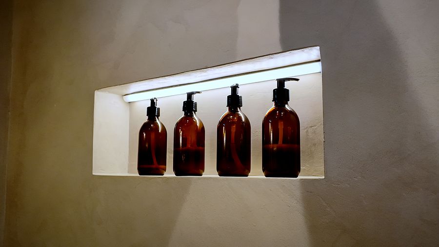 Lit recessed shelf in a plaster-finish wall