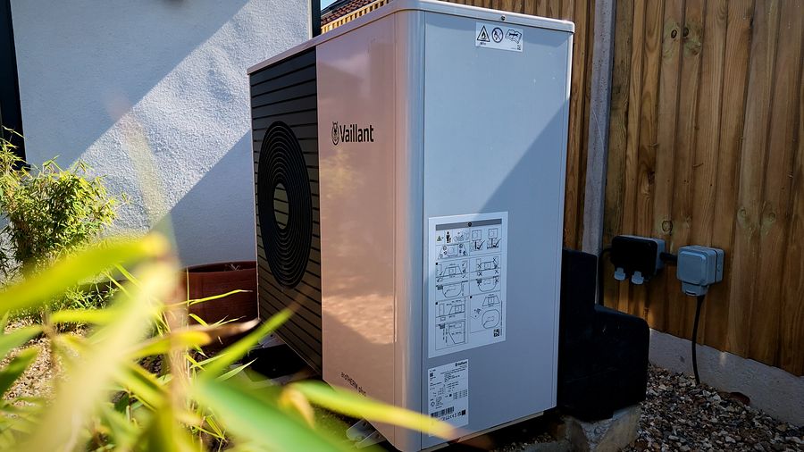 Air source heat pump beside the house