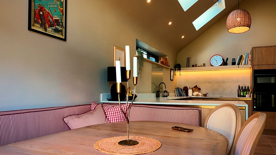 Dining area with built-in bench seating beside the kitchen